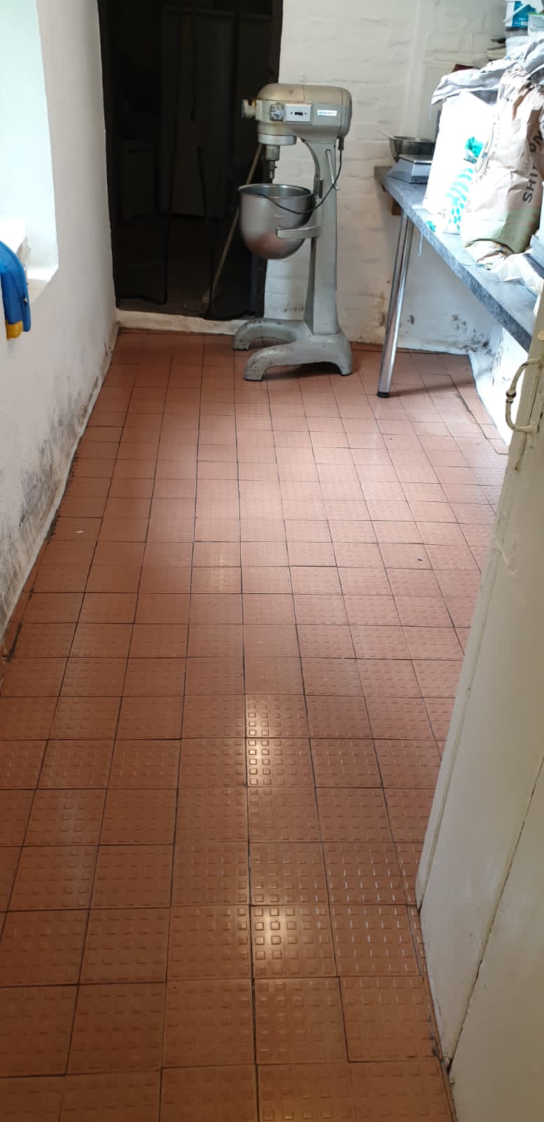 Cleaned hard floor in commercial kitchen