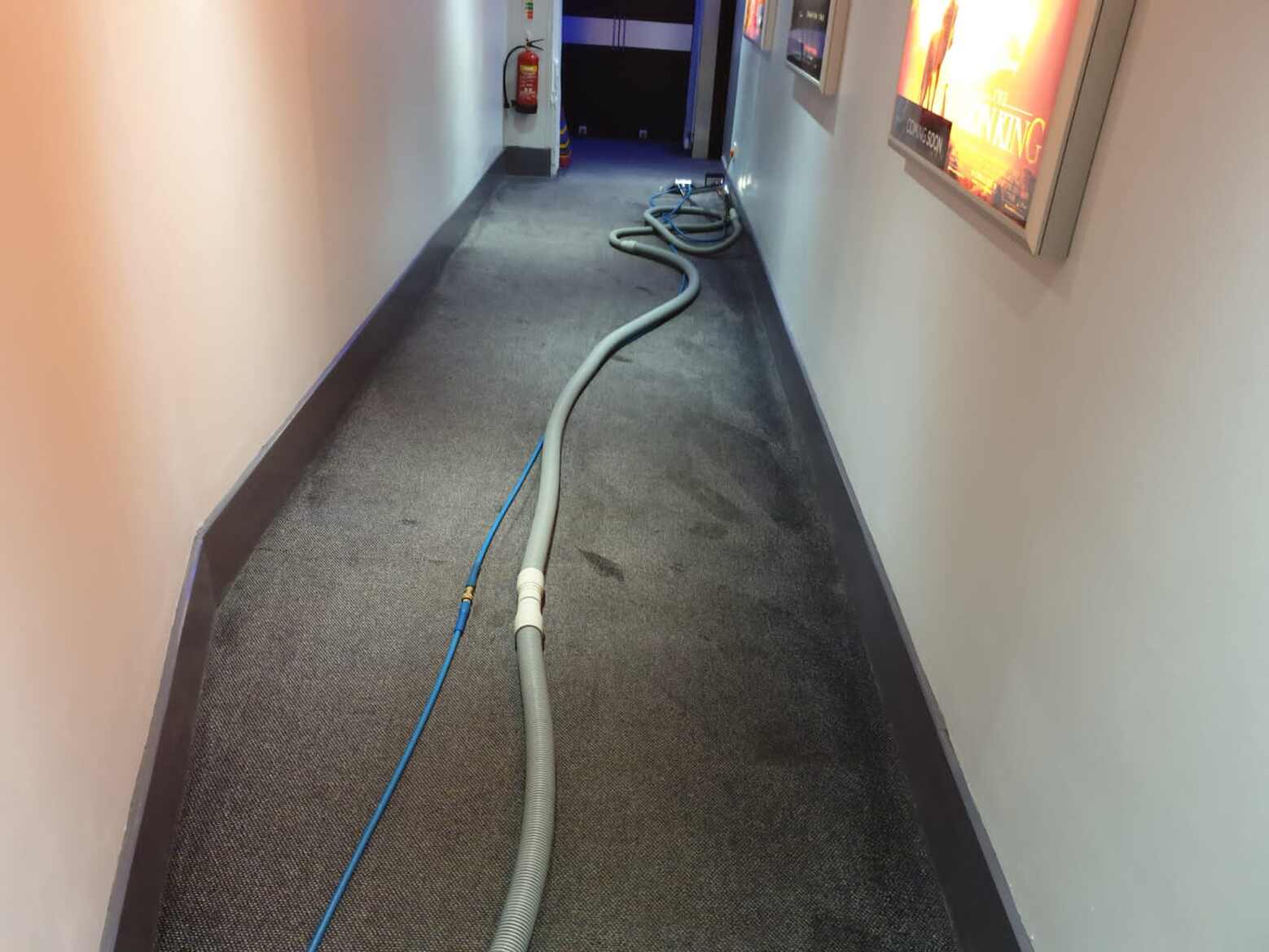 Cinema hallway carpet being washed