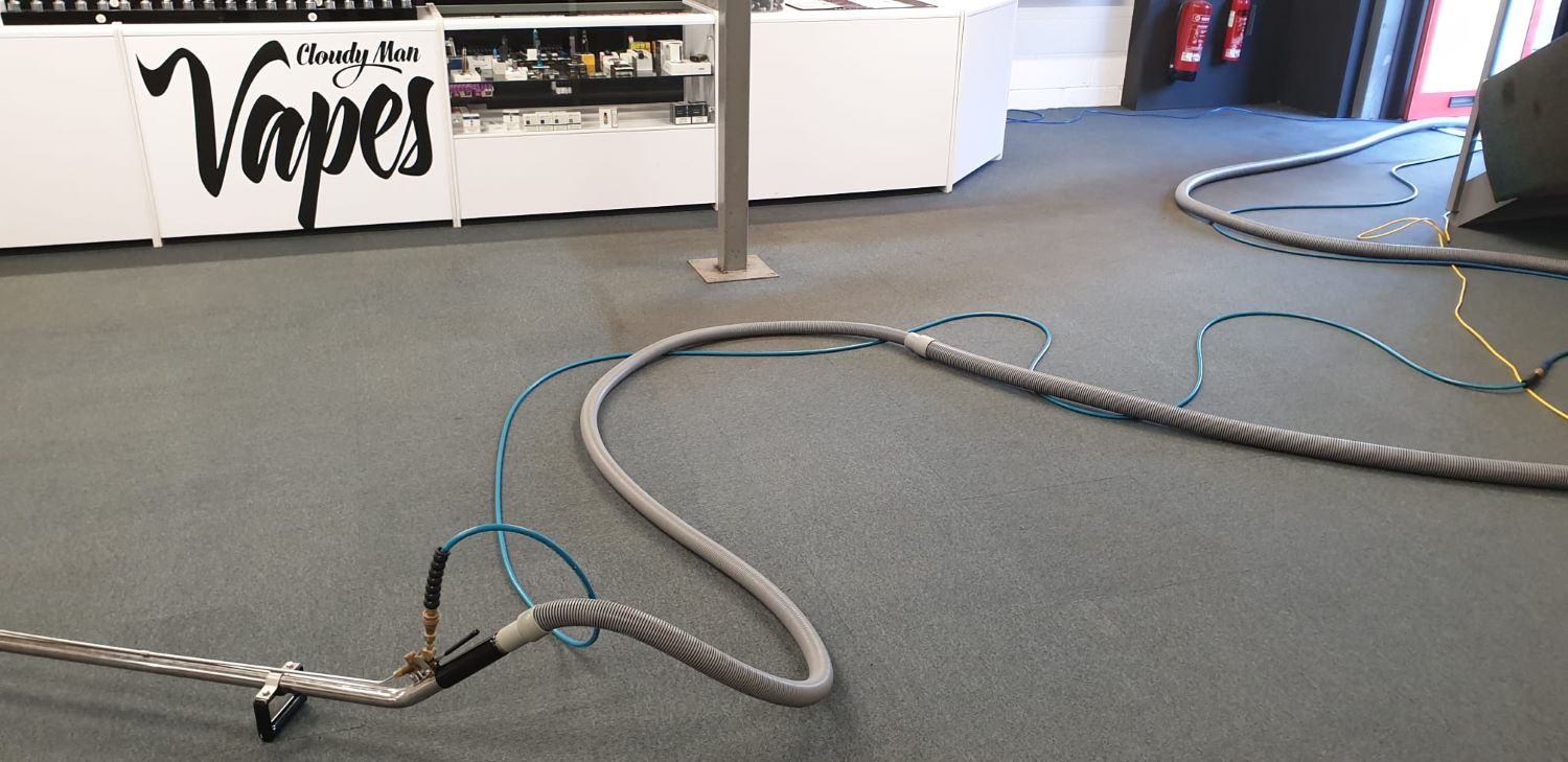 Cleaning carpets in a shop