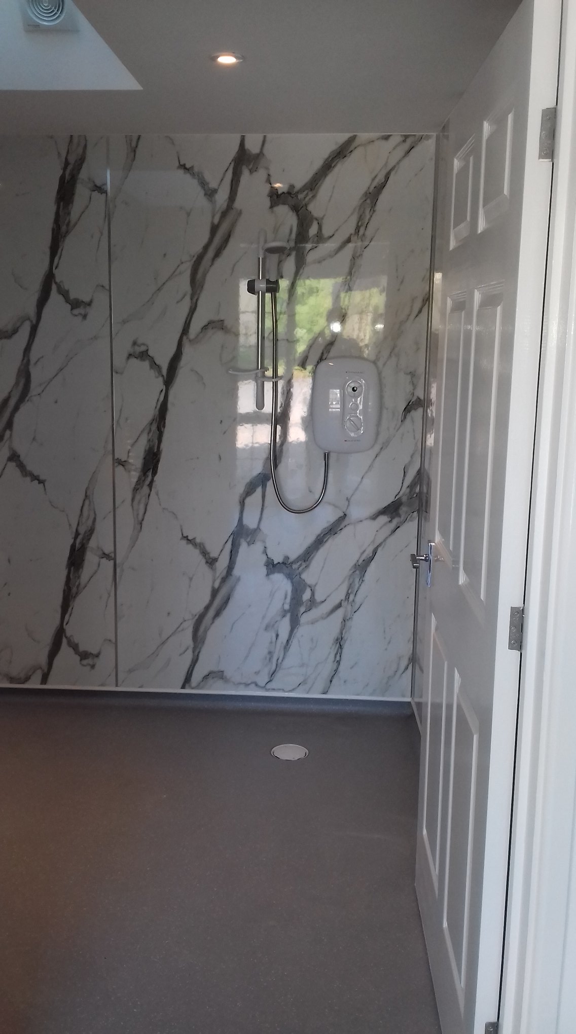 Marble tiled shower room