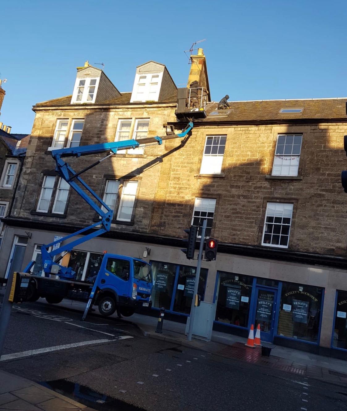 Roofing repairs using a cherry picker